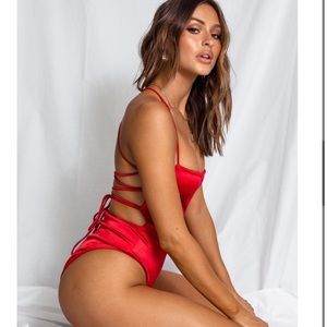 Red open back body suit